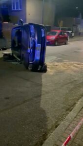 hocking moment a car is flipped when it hits a parked car on residential street